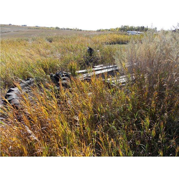 assorted misc piles of lumber and old truck camper, misc parts