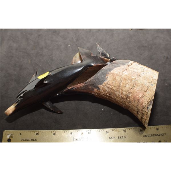 Dolphin carved from horn
