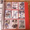 Image 21 : packed binder assorted hockey cards tons of goalies plus serial numbered Joe Sakic card plus rookies