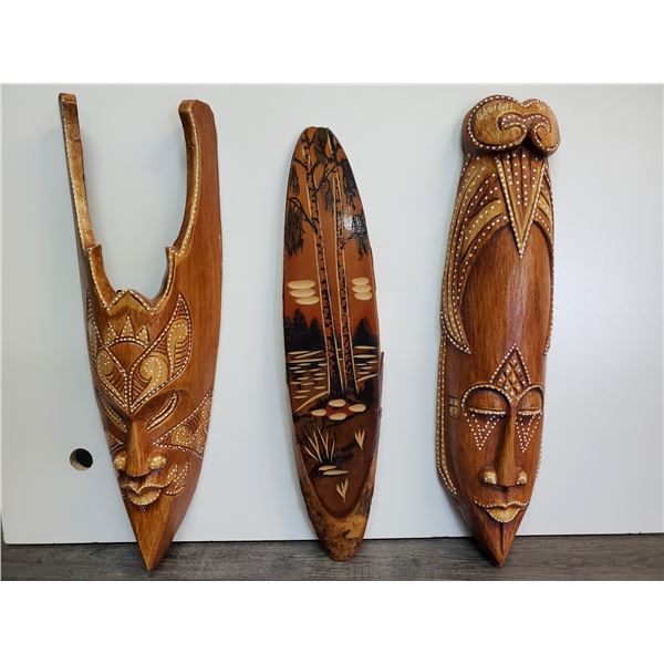 Two Wooden masks & one wooden wall plaque