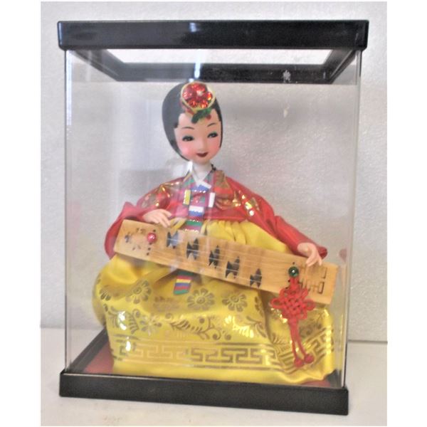 Doll in Display Case