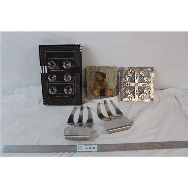 dresser knobs, two wall decor pieces, three pronged "catering life" item