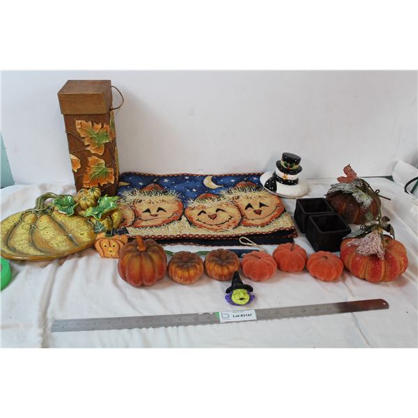 Pumpkin decor; table runner, plate, box, and a melted snowman