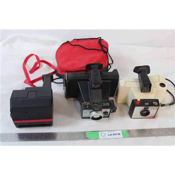 3 Polaroid cameras