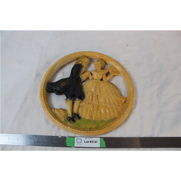 Chalkware wallhanging of victorian couple