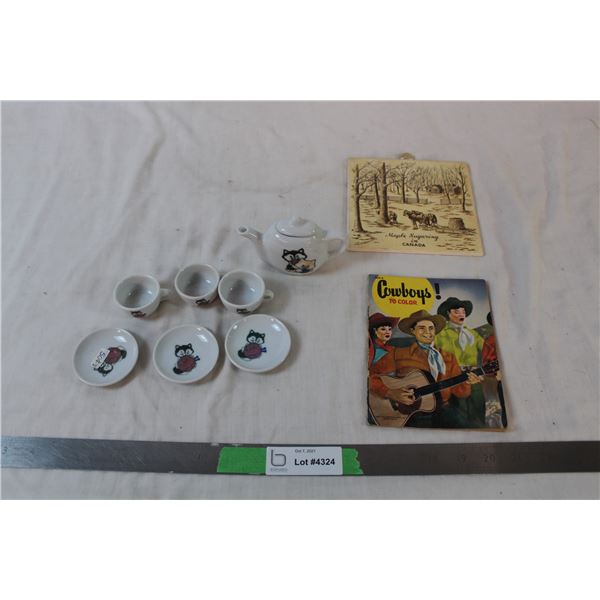 Mini tea set, used cowboy colouring book, and ceramic pot holder