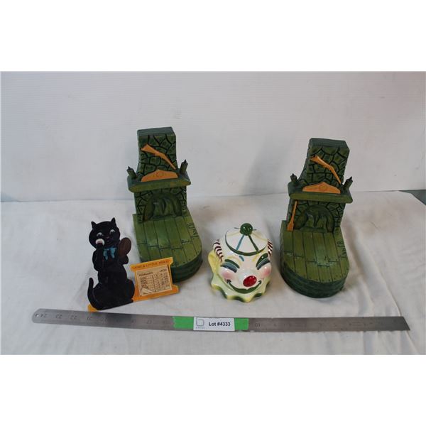 1930 desk calender, fireplace bookends, vintag clown coin bank, flashlight