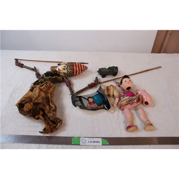 Broken marionette, broken doll with photo, plastic tank