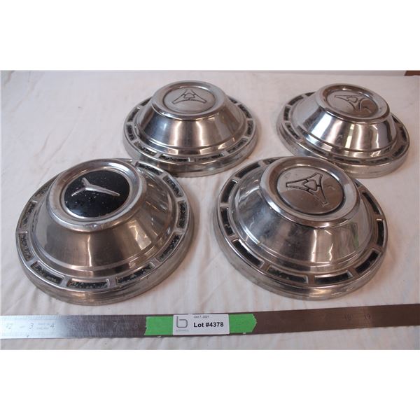Set of four vintage hubcaps