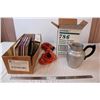 Image 1 : Box of light switches and plugs, metal milk jug, extention cord, and cookbooks