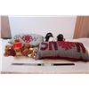 Decorative holiday pillows, snowman family, and story teddy bear