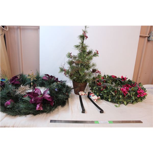 Holiday wreaths and a table sized fake tree