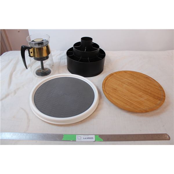 Two lazy-susans, glass coffee pot, plastic spinning storage container