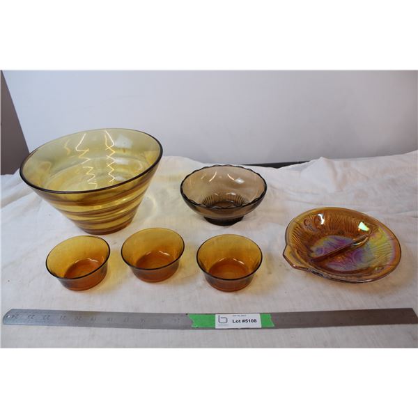 Coloured glass bowl set, one carnival glass bowl