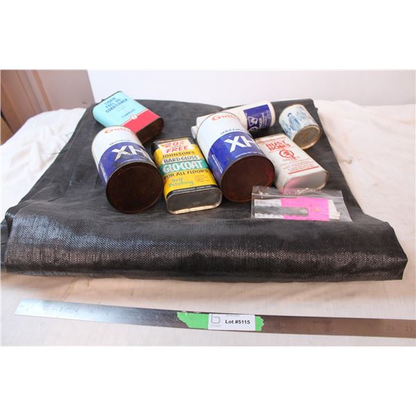 Vintage oil cans, and black tarp