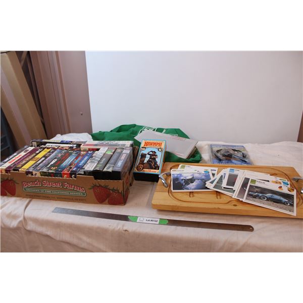 VHS tapes, MS Dos handbook, car and plane informational cards, wooden serving tray, panasonic headse