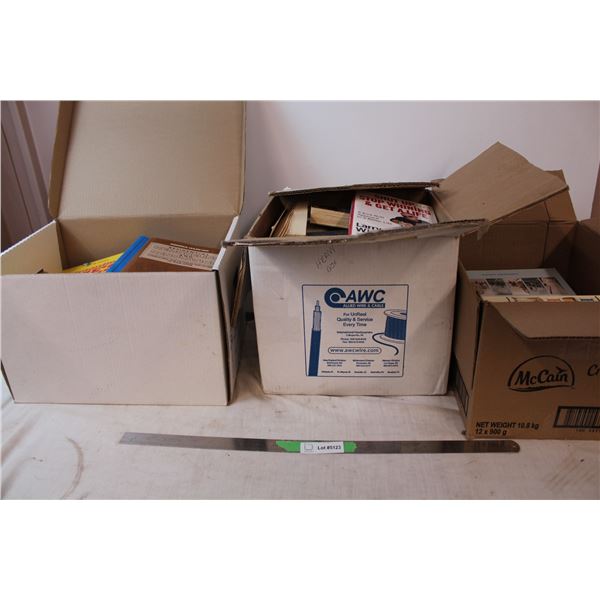 Three boxes of books, all different genres