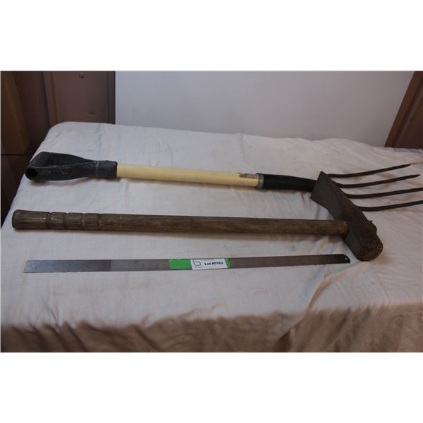 Pitch fork and vintage railroad hammer