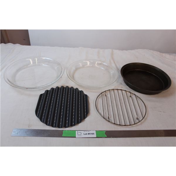 Two glass pyrex and one metal pie tin with accessories