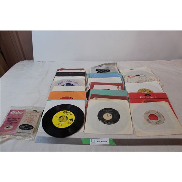 Lot of 45 RPM records, and cleaning cloth