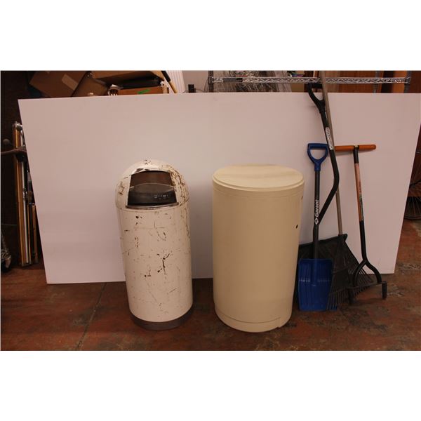 metal and plastic trash cans with various gardening tools