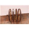 Image 1 : set of four cast iron farm implement wheels on axel 33” long 25” wheel diameter