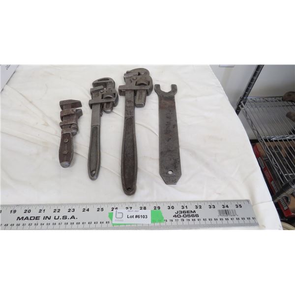 3 pipe wrenches + 1 wrench