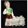 Image 1 : PORCELAIN BOY WITH ANTIQUE LOCOMOTIVE CIRCA #2139940