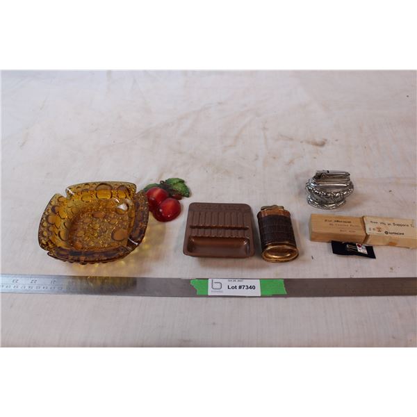 Two lighters, glass ashtray, tie clip from 1972 Sapporo Olympics