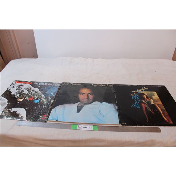 Three records; Neil Diamond, Holiday Magic, Flashdance
