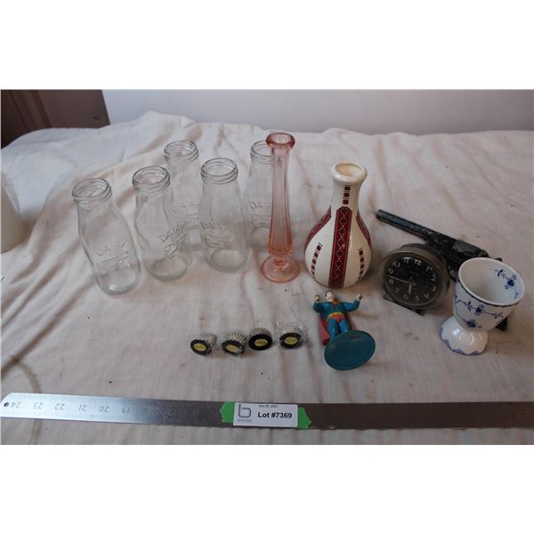 Vintage "Mustang" cast iron Gun, vintage Superman statue, big ben alarm clock, Dairy Milk bottles