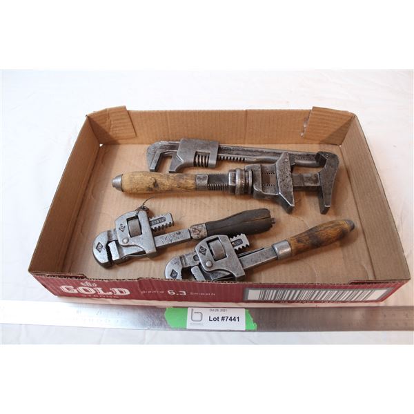 Vintage pipe wrenches with wooden handles