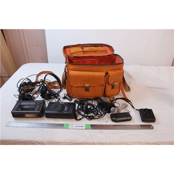 portable cassette players with headphones, in vintage leather bag