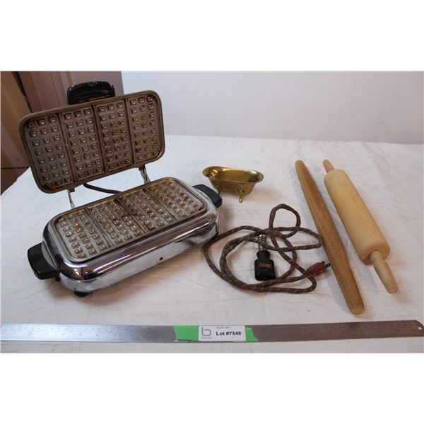 Vintage waffle iron, wooden rolling pins, brass bathtub