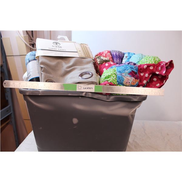 Bucket of blankets and tea towels