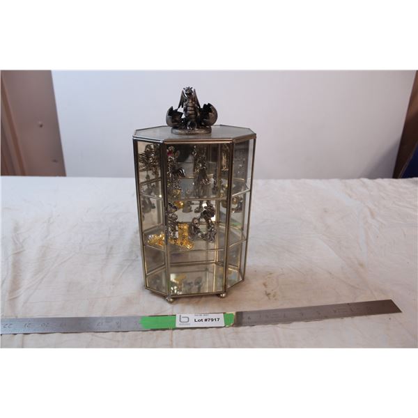 Glass display case with magical figures