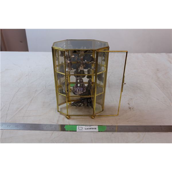 Glass display case with magical figures