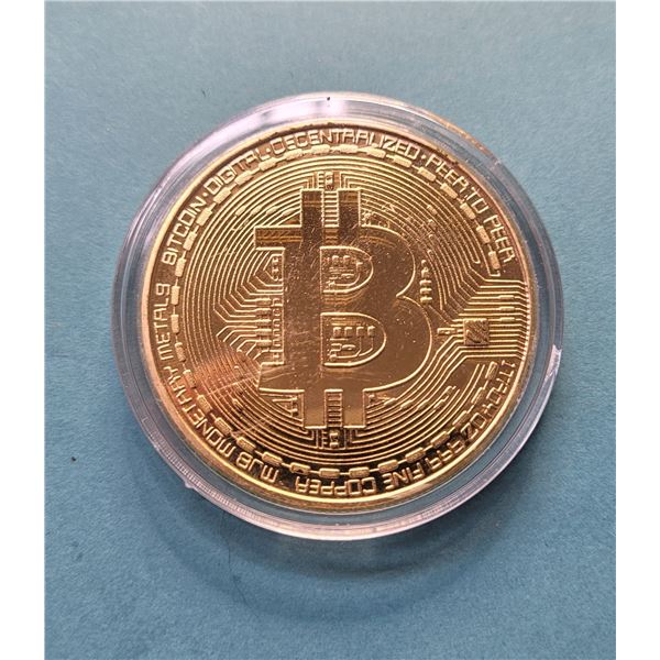 23)  ENCAPSULATED GOLD TONE BITCOIN.