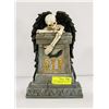 Image 1 : SKELETON WITH WINGS STANDING BEHIND TOMBSTONE