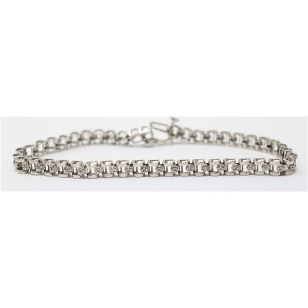10K WHITE GOLD TENNIS BRACELET WITH CLEAR STONES