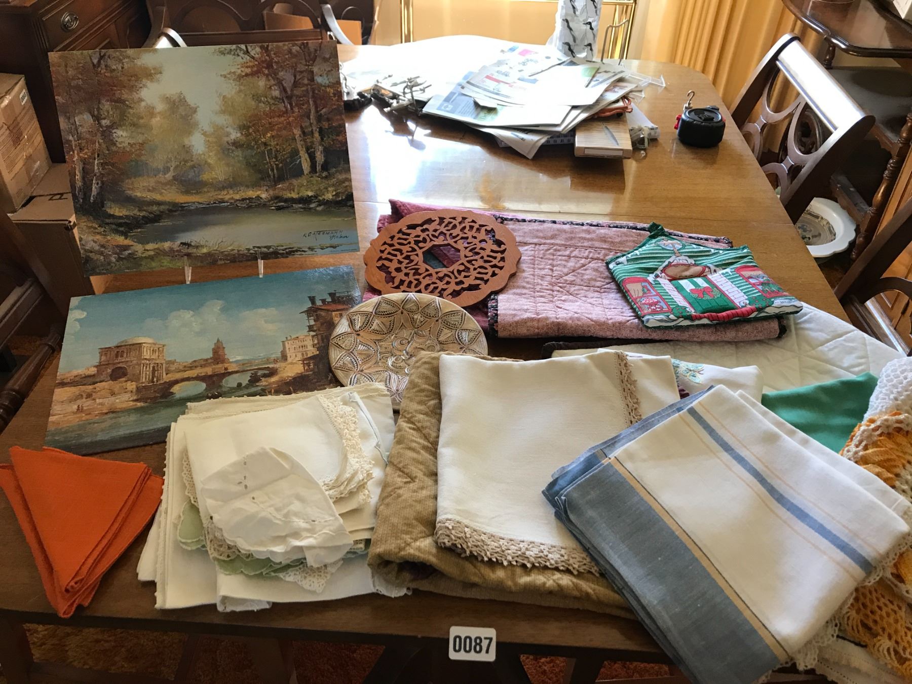 Assorted Table Linens, 2 Paintings and Trivets - Beck Auctions Inc.