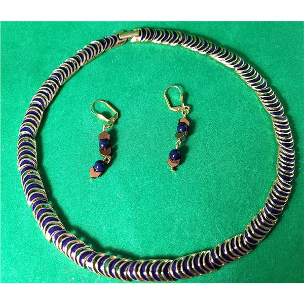 18)  VINTAGE ARTICULATED GOLD TONE AND NAVY