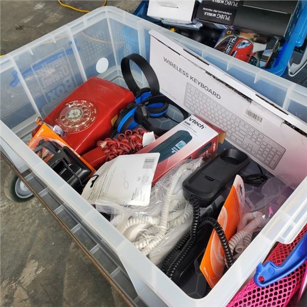 Bin of various phones and headsets including vintage rotary