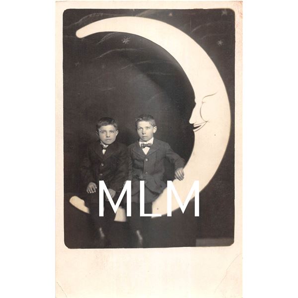 Two Children Sitting on Paper Moon Photo Postcard
