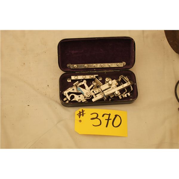 WHITE SEWING MACHINE PARTS IN  NICE, MONOGRAMMED BLACK METAL BOX
