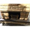Image 2 : Faux stone fireplace mantle w/ electric fireplace inset from the show
