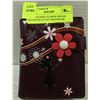 Image 1 : GIRL HOLDING FLOWER DESIGN PLUM WALLET BY SHAGWEAR