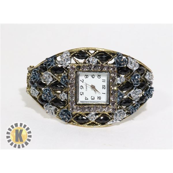 LARGE RHINESTONE FLORAL CLAMPER WATCH