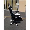 Image 2 : AS NEW BLACK AND WHITE GAS LIFT GAMING CHAIR - cracked casing on right side spring cover
