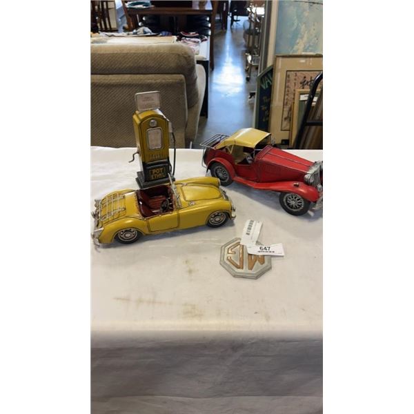 2 METAL CAR FIGURES, POT ETHYL GAS CAN FIGURE AND MG SIGN